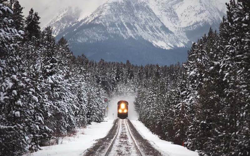 Train going through the snow in Canada